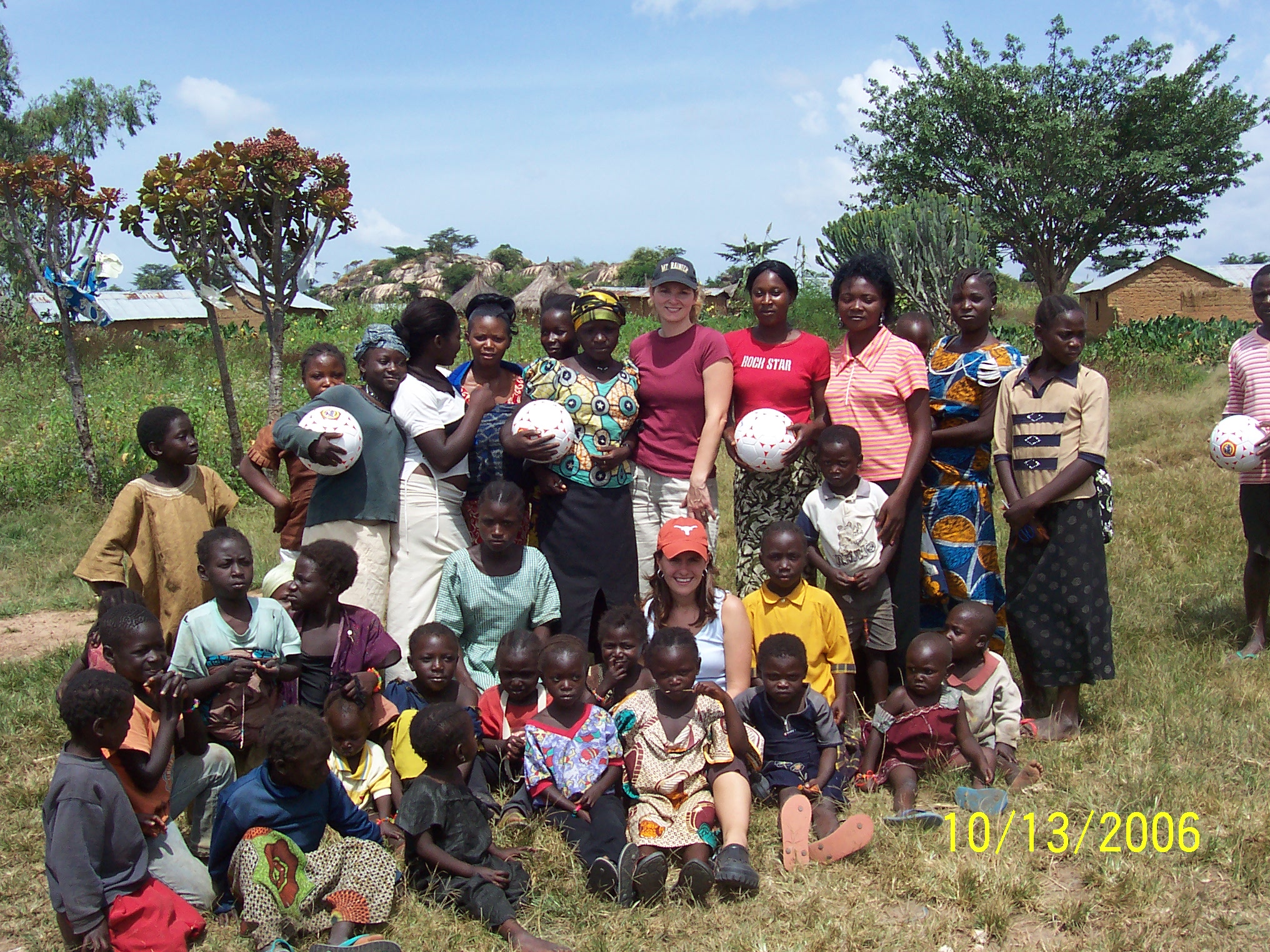 Handing out soccer balls to children in the village with the Munafos